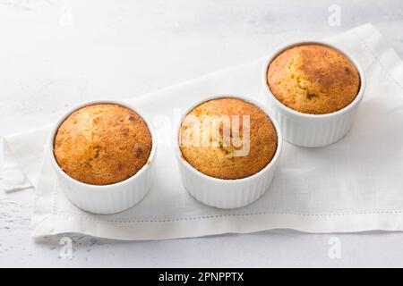 Freshly baked delicious carrot mannik with nuts on a light blue background, top view. Delicious homemade food Stock Photo