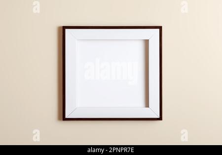 Blank picture frame with dark wood and square shape hanging on a wall mockup for images and posters Stock Photo