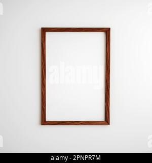 Wooden frame with rectangular vertical shape hanging on a white wall mockup for pictures and posters Stock Photo