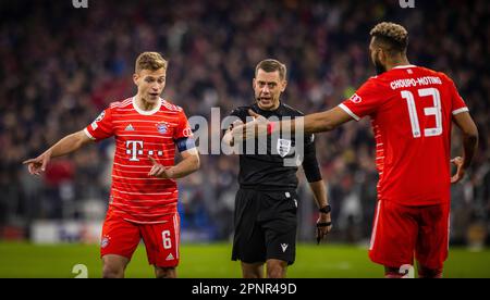 Munic, Germany. 19th Apr, 2023.  Joshua Kimmich (Muenchen), Referee Clement Turpin , Eric Maxim Choupo-Moting (Muenchen) FC Bayern München - Mancheste Stock Photo