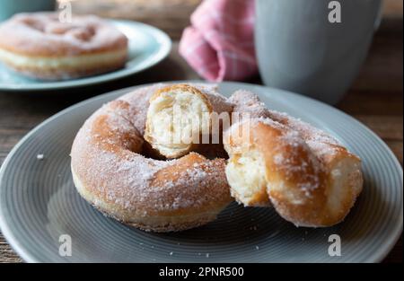 Doughnut pretzel with sugar topping. Traditional german sweet yeast pastry or Krapfen Stock Photo