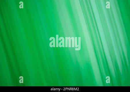 Pistachio color blur bokeh. Abstract green blurred gradient background with light. Stock Photo
