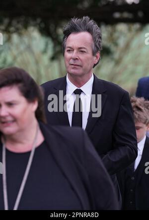 Comedian Julian Clary arriving for the funeral of Paul O'Grady at St Rumwold's Church in Aldington, Kent. Picture date: Thursday April 20, 2023. Stock Photo