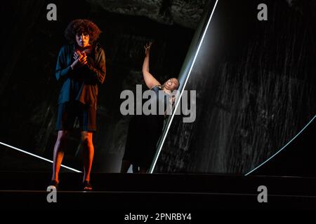 l-r: Idunnu Münch (Girlfriend 3 / Congregant 3), Nadine Benjamin (The Mother) in BLUE opening at English National Opera (ENO), London Coliseum, London WC2  20/04/2023 music: Jeanine Tesori  libretto: Tazewell Thompson  conductor: Matthew Kofi Waldren  set & costume design: Alex Lode  video design: Ravi Deepres  lighting: James Farncombe  choreography: Ingrid Mackinson  director: Tinuke Craig Stock Photo