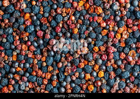 Homemade dried wild berries in background, close up, top view. Food background. Healthy food, mix of colorful dry berry Stock Photo