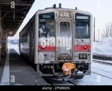 A JR Hokkaido KiHa 54 series train on a winter day at Rumoi Station in Japan. Stock Photo