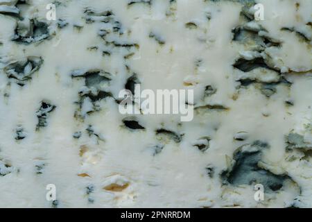 Blue cheese background and texture in the cut, top view, close up, macro Stock Photo