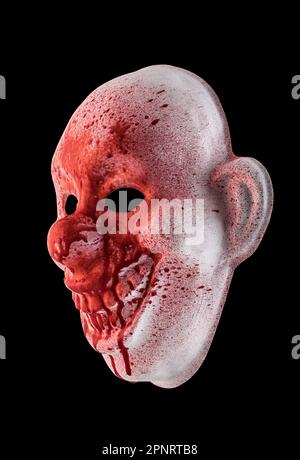 Scary clown halloween mask in blood isolated on black background with clipping path Stock Photo