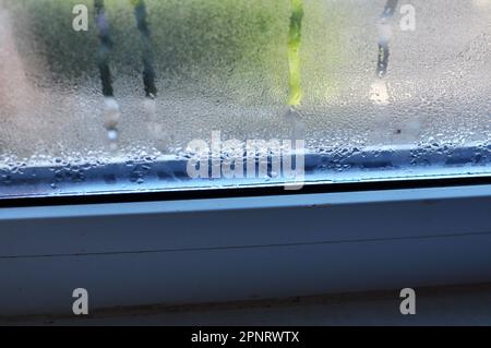 Fogging of metal plastic windows due to cooling and high humidity Stock Photo
