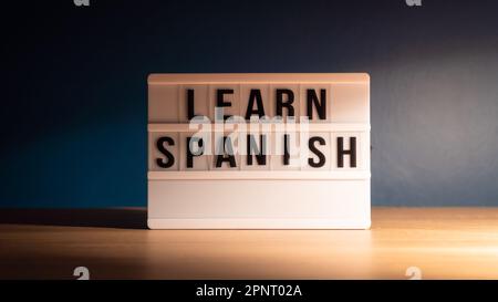 Learning language concept. Learning Spanish word on white letter board. Foreign language course concept. Stock Photo