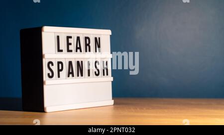 Learning language concept. Learning Spanish word on white letter board. Foreign language course concept. Stock Photo