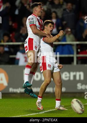 St Helens Saints' Jon Bennison (right) celebraters his try with Lewis Dodd, during the Betfred Super League match at the Totally Wicked Stadium, St Helens. Picture date: Thursday April 20, 2023. Stock Photo