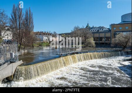 Waterfall in the historic industrial landscape during spring in Norrköping, Sweden Stock Photo