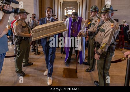 Nashville, Tennessee, USA. 17th Apr, 2023. U.S. Rep ?Justin Jones (??D-Nashville?)? attempts to bring an empty casket into the Tennessee Capitol chamber with Bishop William Barber II, during a ?''Moral Monday?''? rally to address gun violence on April 17, 2023 in Nashville, Tennessee. In the wake of the March shooting at The Covenant School, in the Green Hills neighborhood of Nashville, organizations have mobilized around U.S. Rep ?Justin Jones? (?D-Nashville?), and ?U.S. Rep ?Justin J. Pearson? (??D-Memphis?)? ?who ?have drawn? ?national attention? ?pushing for gun safety laws. (Cre Stock Photo