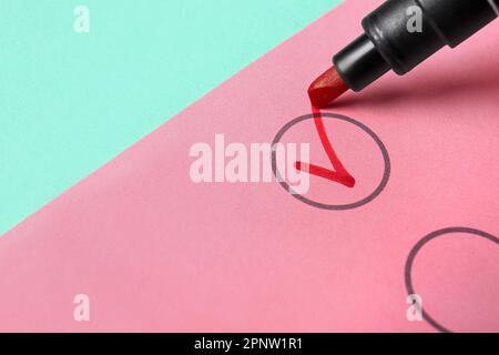 Red pen marking on checklist box, closeup Stock Photo