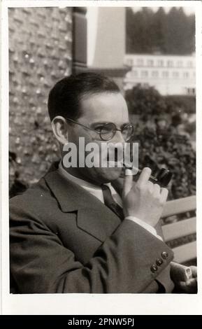 HODONIN, THE CZECHOSLOVAK REPUBLIC, JUNE 1938: Vintage photo of man with pipe, June 1938. Stock Photo