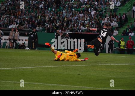 Lisbon, Lisbon, Portugal. 20th Apr, 2023. ARKADIUSZ MILIK, of Juventus Torino, falls to the ground after a contact with goalkeeper ANTONIO ADÃN, of Sporting CP, during the 2023 UEFA Europa League second leg quarter-final match between Sporting CP and Juventus Torino at José Alvalade Stadium. (Credit Image: © Alexandra Fechete/ZUMA Press Wire) EDITORIAL USAGE ONLY! Not for Commercial USAGE! Stock Photo