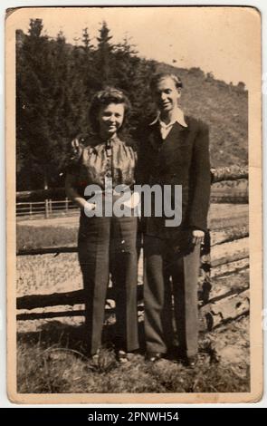 Vintage photo shows young man and woman. Stock Photo