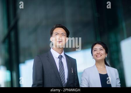 Businessmen and businesswomen looking into the distance Stock Photo