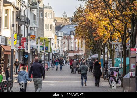 Picture of the main street of Troisdorf, Kolner strasse, with shops and stores while people are passing by. Troisdorf is a city in the Rhein-Sieg-Krei Stock Photo