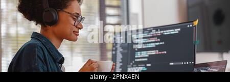 Female freelancer making new project as web designer and programmer on her computer at home office Stock Photo