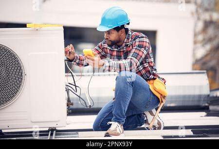 Air conditioner, cables and technician man ac repair, maintenance or working on electrical power generator. African person, electrician or contractor Stock Photo
