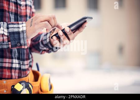 Phone, hands and maintenance man typing online search for repair instructions, guide manual or scroll on website ui. Outdoor mobile connection Stock Photo