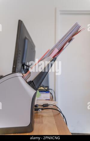 Desktop paper document scanner with stack of documents Stock Photo - Alamy
