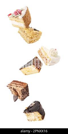 Cake pieces in the air. Falling down cake slices isolated on white backgroung Stock Photo