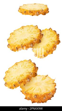 Isolated flying pineapple. Falling sliced ananas fruit isolated on white background with clipping path Stock Photo