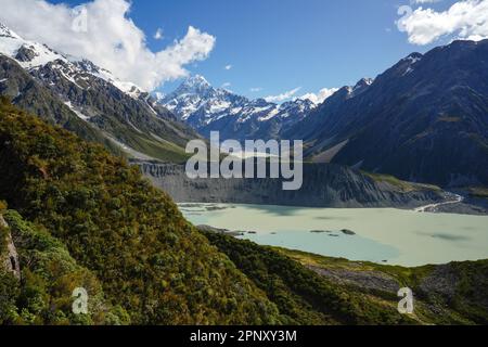 Treking in Mount Cook/Aoraki National Park in New Zealand on the South Island in the summer. Mountains and glacial features with a glacial lake. Stock Photo