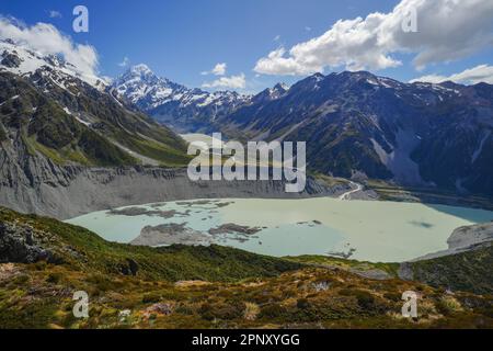 Treking in Mount Cook/Aoraki National Park in New Zealand on the South Island in the summer. Mountains and glacial features with a glacial lake. Stock Photo