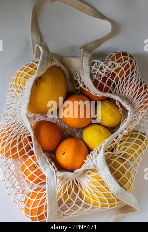 citrus fruits in a string bag Stock Photo