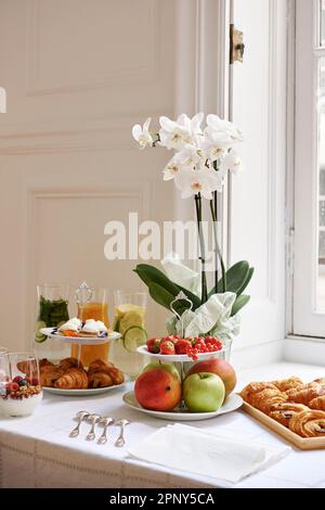 Delicious breakfast spread in sophisticated Parisian apartment Stock Photo