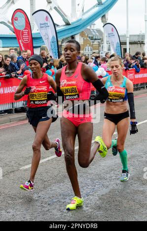 Diane Nukuri competing in the Virgin Money London Marathon 2015 crossing Tower Bridge, UK. Female elite athletes Stock Photo