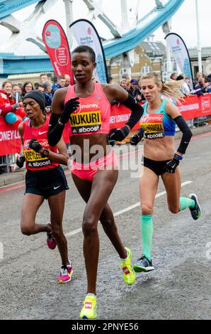Diane Nukuri competing in the Virgin Money London Marathon 2015 crossing Tower Bridge, UK. Elite female athletes Stock Photo