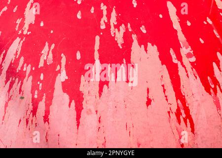 Peeling red paintwork on a car bonnet / hood. For seen better times or days, bad paintwork, unreliable flakey personality. Car is a Fiat Punto. Stock Photo