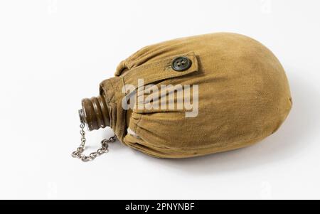 Old soldier's aluminum water flask isolated on white background Stock Photo