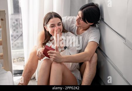 Lovers sharing gifts on special and memorable anniversaries. A couple spending quality time to celebrate together. A romantic and lovely moment create Stock Photo