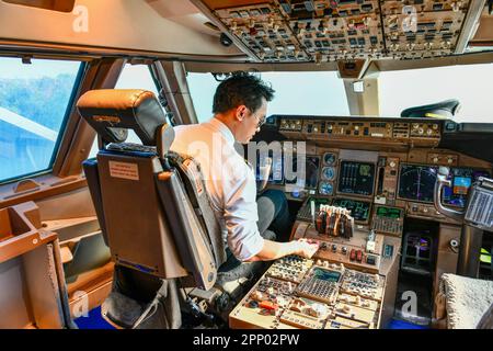 Airline pilot work in the cockpit Stock Photo