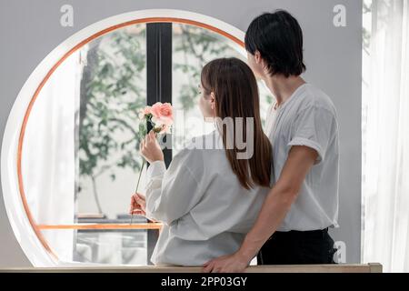 Lovers sharing gifts on special and memorable anniversaries. A couple spending quality time to celebrate together. A romantic and lovely moment create Stock Photo