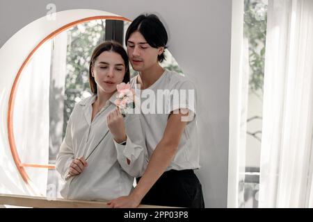 Lovers sharing gifts on special and memorable anniversaries. A couple spending quality time to celebrate together. A romantic and lovely moment create Stock Photo