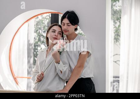 Lovers sharing gifts on special and memorable anniversaries. A couple spending quality time to celebrate together. A romantic and lovely moment create Stock Photo