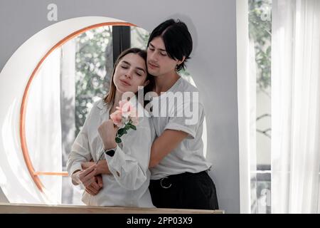 Lovers sharing gifts on special and memorable anniversaries. A couple spending quality time to celebrate together. A romantic and lovely moment create Stock Photo