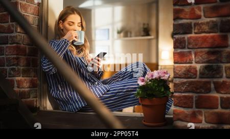 Beautiful woman in striped pyjamas on a Christmas Day Stock Photo - Alamy