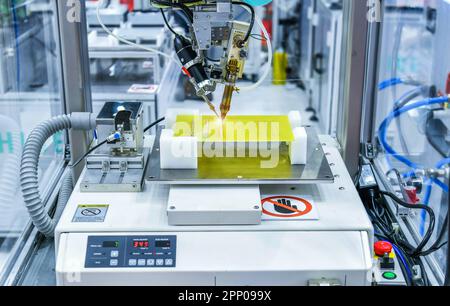 Technological process of soldering and assembly chip components on pcb board. Automated soldering machine inside at industrial Stock Photo