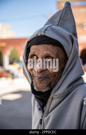 Portrait of an elderly Berber man dressed in a djellaba and a black turban. Stock Photo