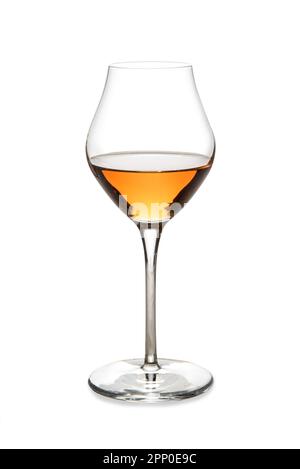 Amber sweet wine or italian wine passito in glass isolated on white with clipping path included Stock Photo