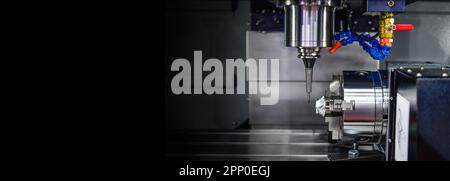 The 5-axis CNC mills machines for design configuration that utilizes a swivel head machine table and flush with the surface metalworking industrial Stock Photo