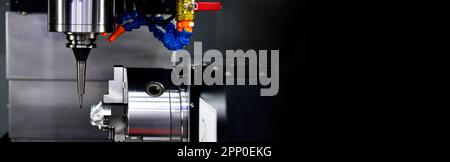 The 5-axis CNC mills machines for design configuration that utilizes a swivel head machine table and flush with the surface metalworking industrial Stock Photo